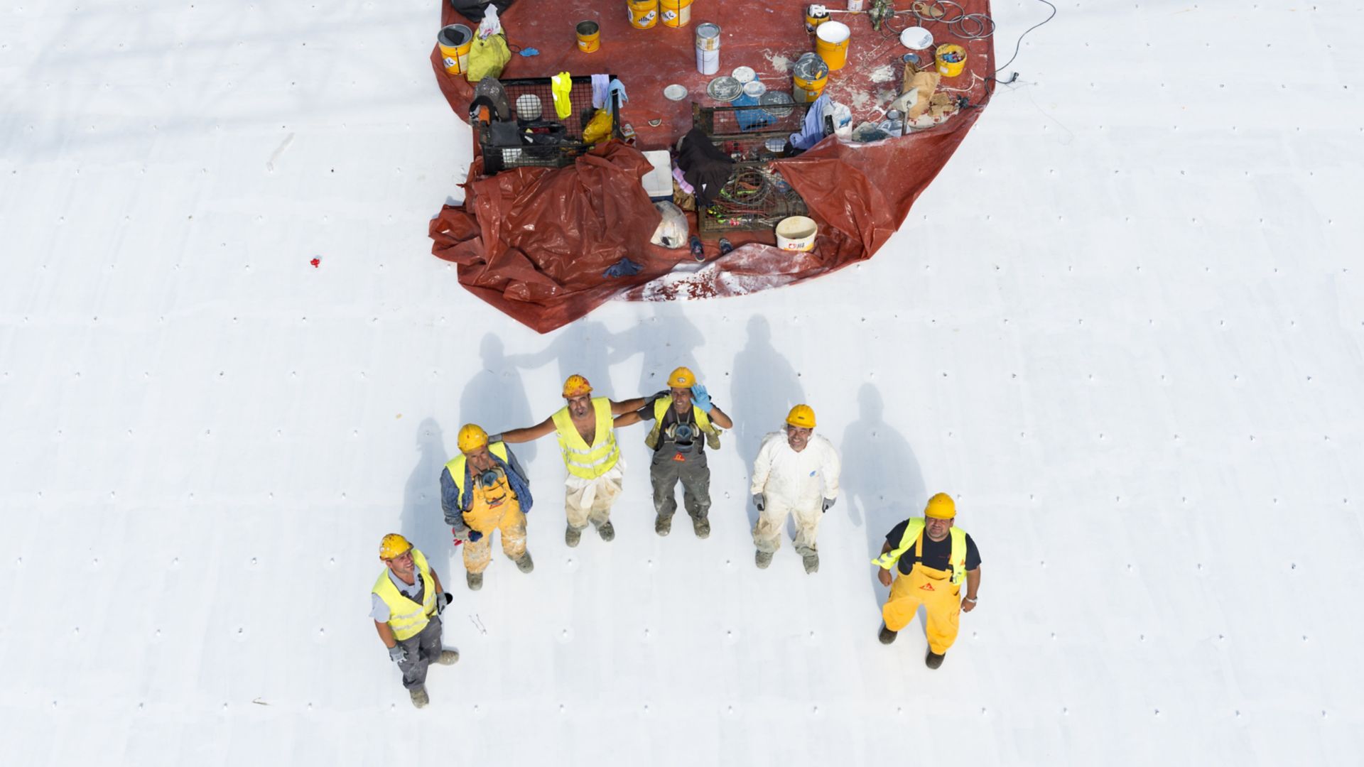 Workers standing on the roof of the Stavros Niarchos Foundation Cultural Center