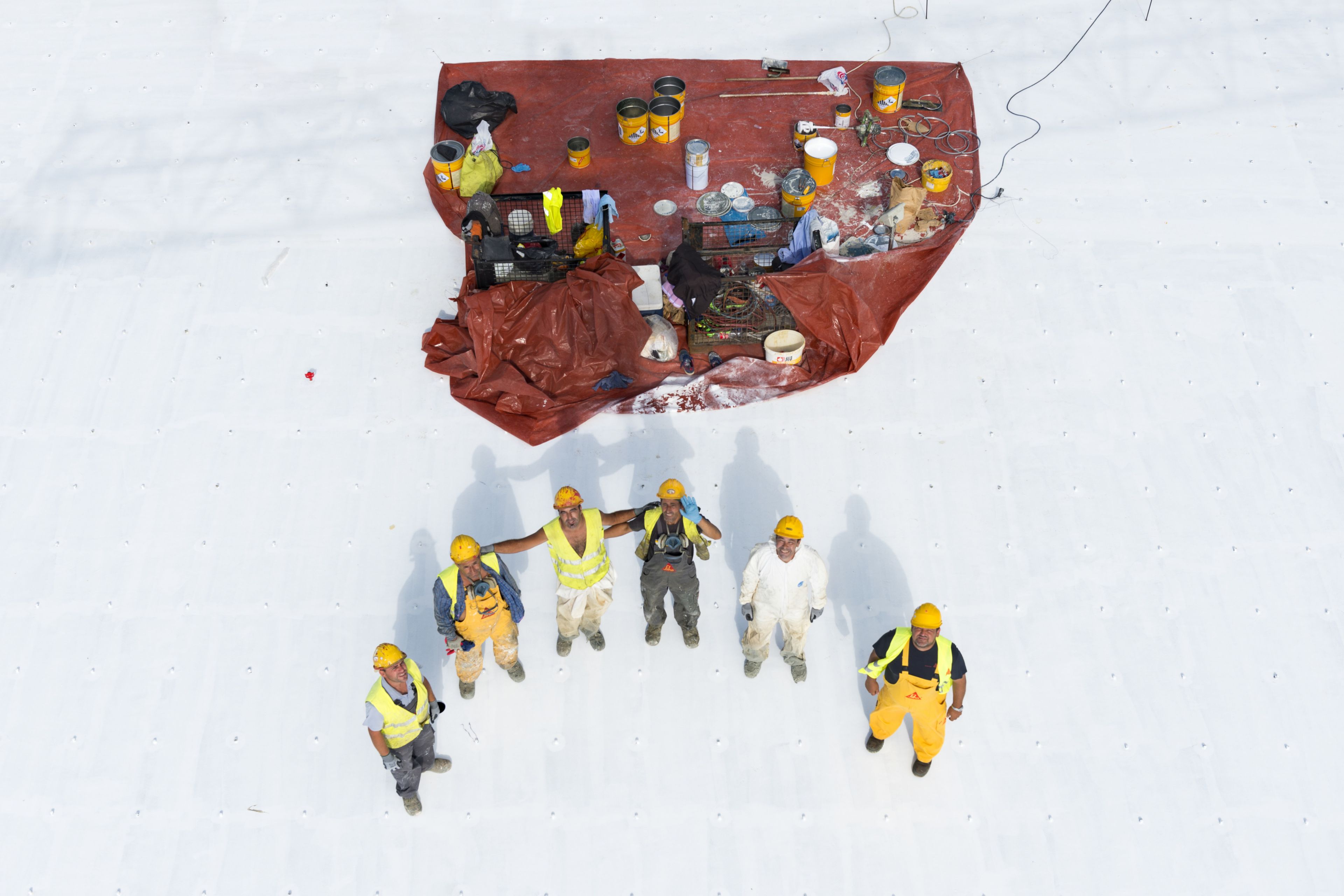 Workers standing on the roof of the Stavros Niarchos Foundation Cultural Center