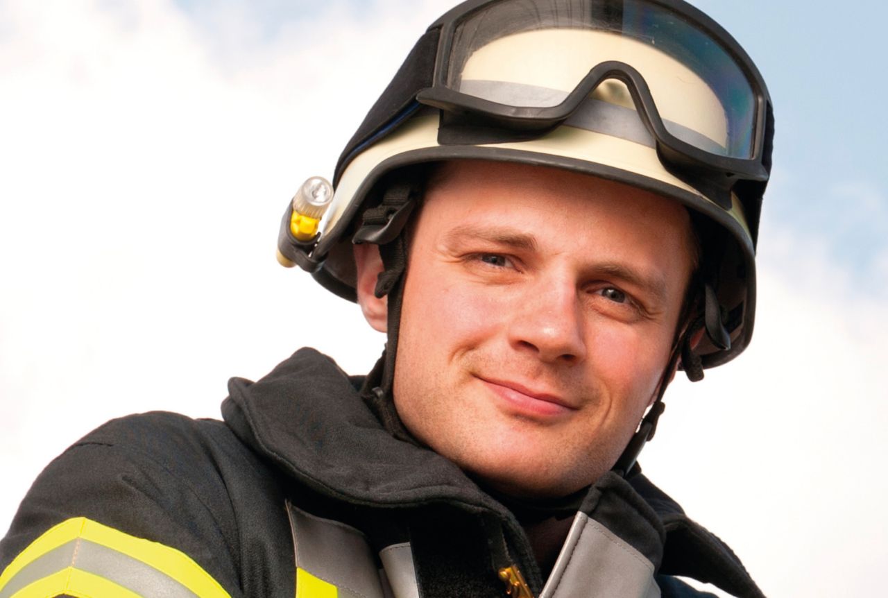 A sitting fireman wearing technical textile bonded with SikaMelt