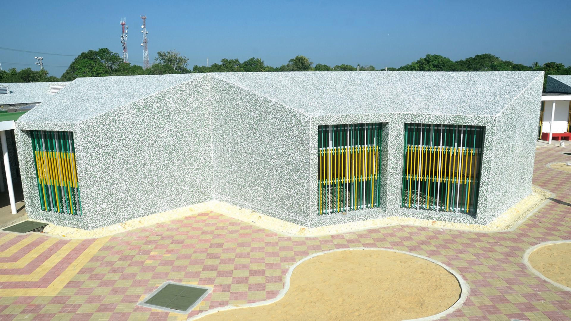 Tile building facade on Child Development Center school in Colombia