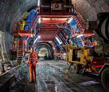 Worker at construction site inside tunnel in Vips Valley in Switzerland