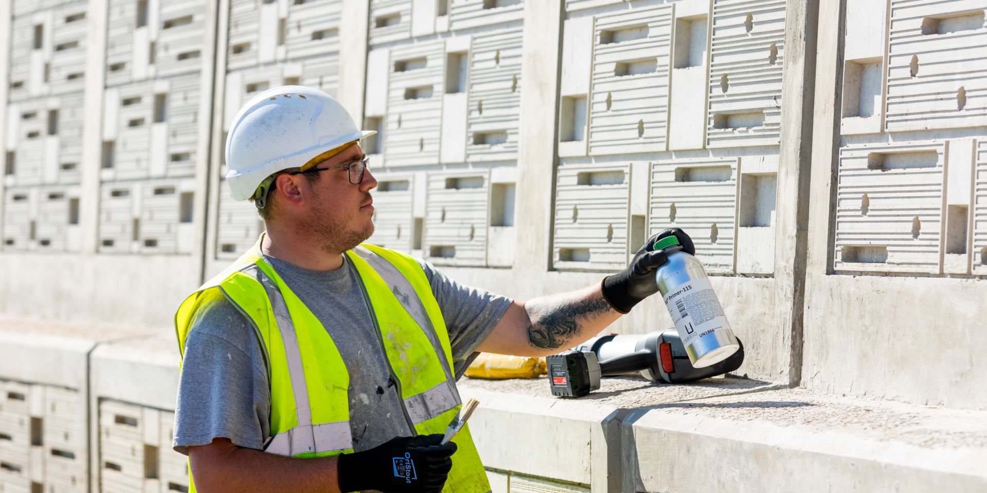 Man about to apply Sika Primer-115 onto a wall