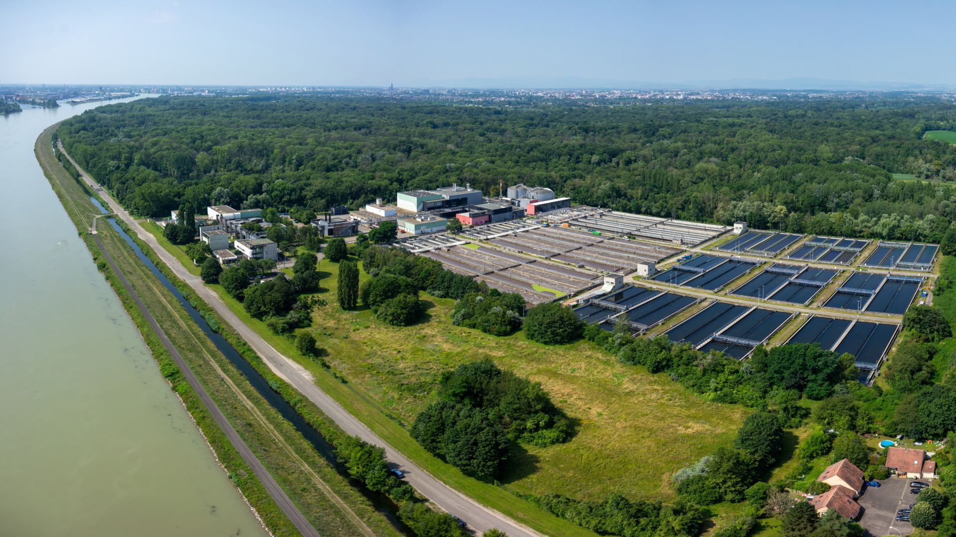 La Wantzenau waste water treatment plant refurbishment in Strasbourg, France river drone photo birds eye view