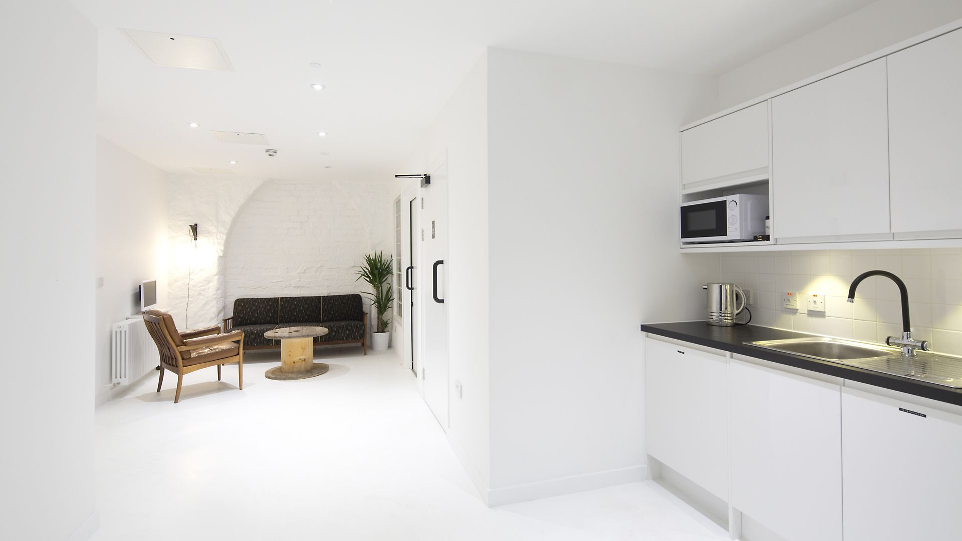 Sika ComfortFloor® white floor in completely white interior of home kitchen