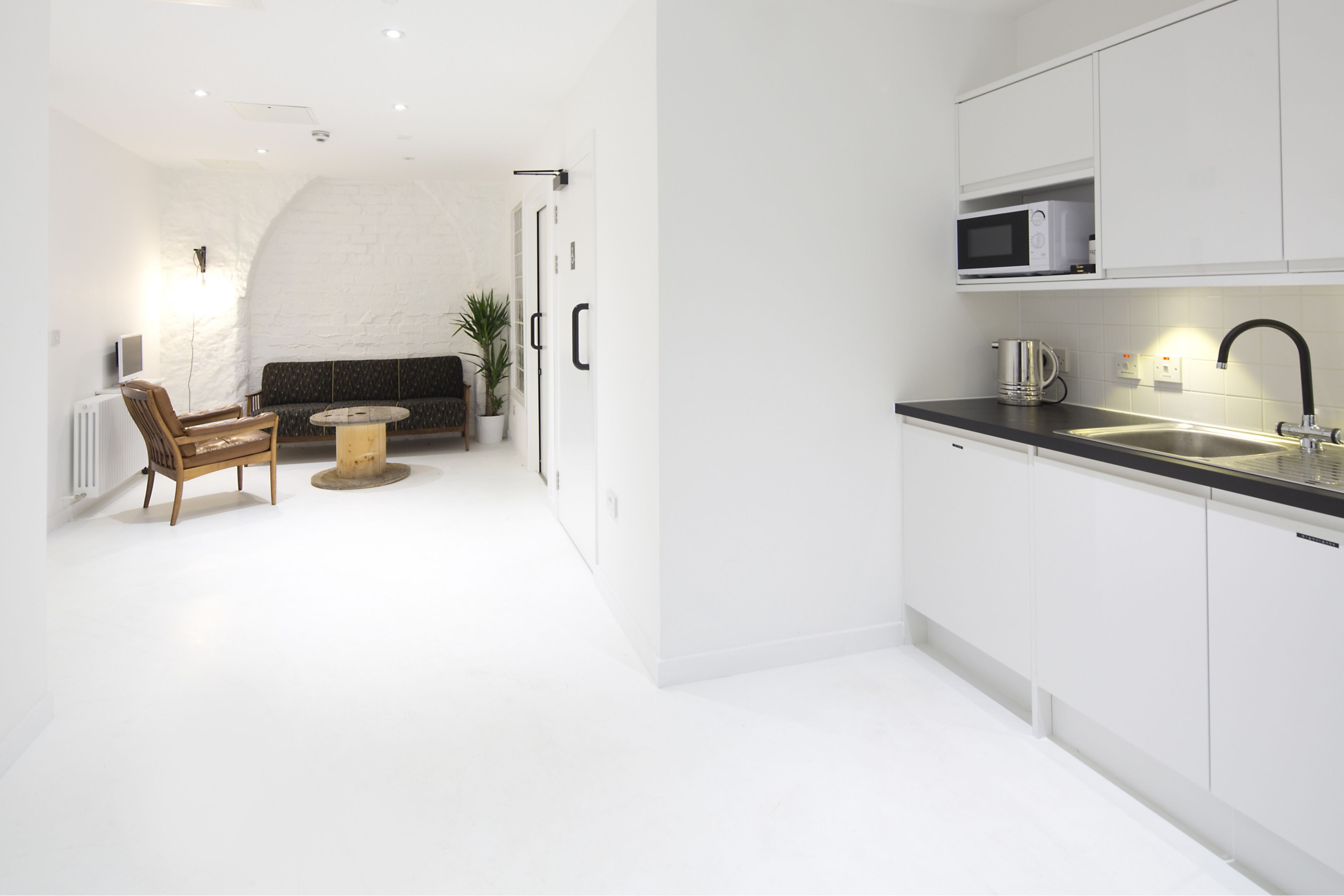 Sika ComfortFloor® white floor in completely white interior of home kitchen