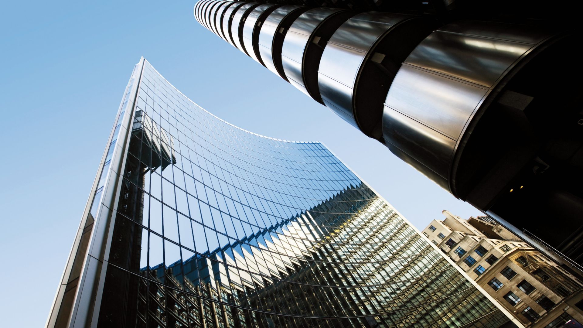 Glass facade with building reflection