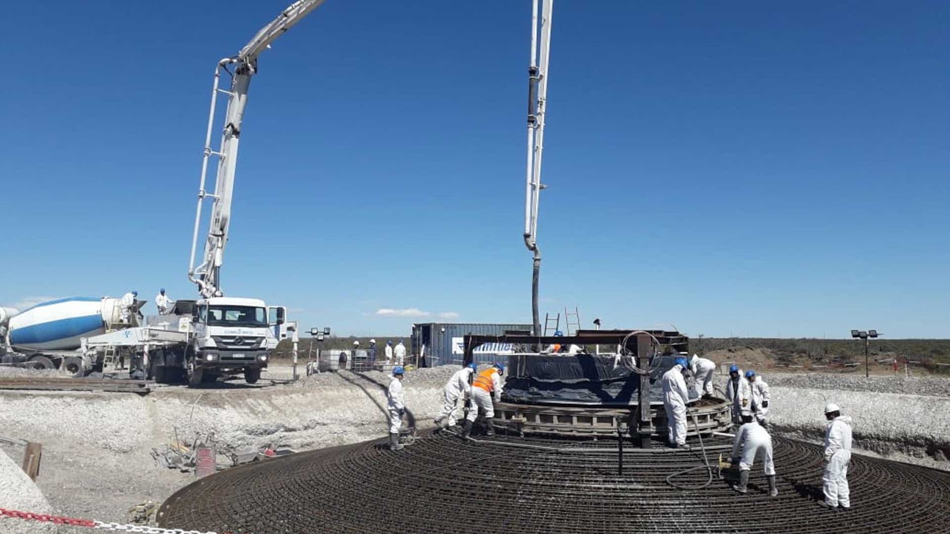 Concrete truck pouring concrete for foundation of wind turbine tower