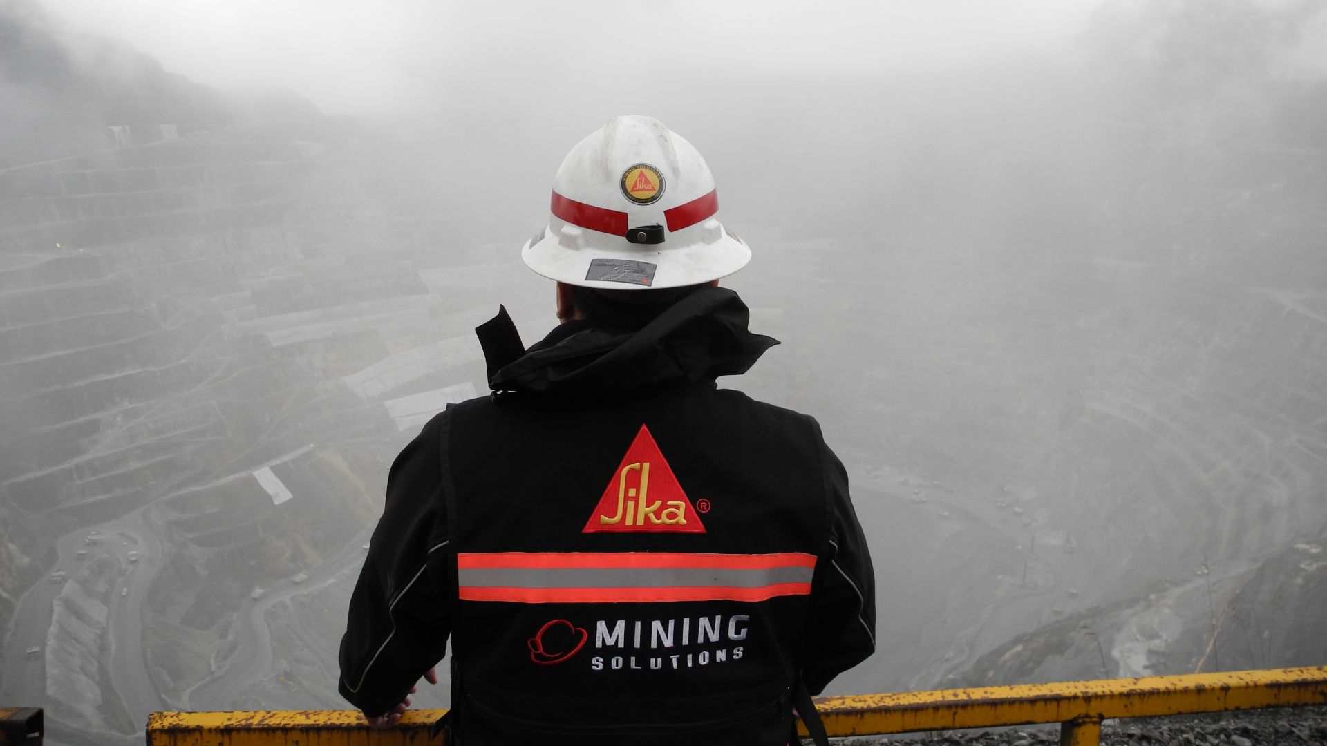 Sika worker looking at the Grasberg Copper-Gold Mine