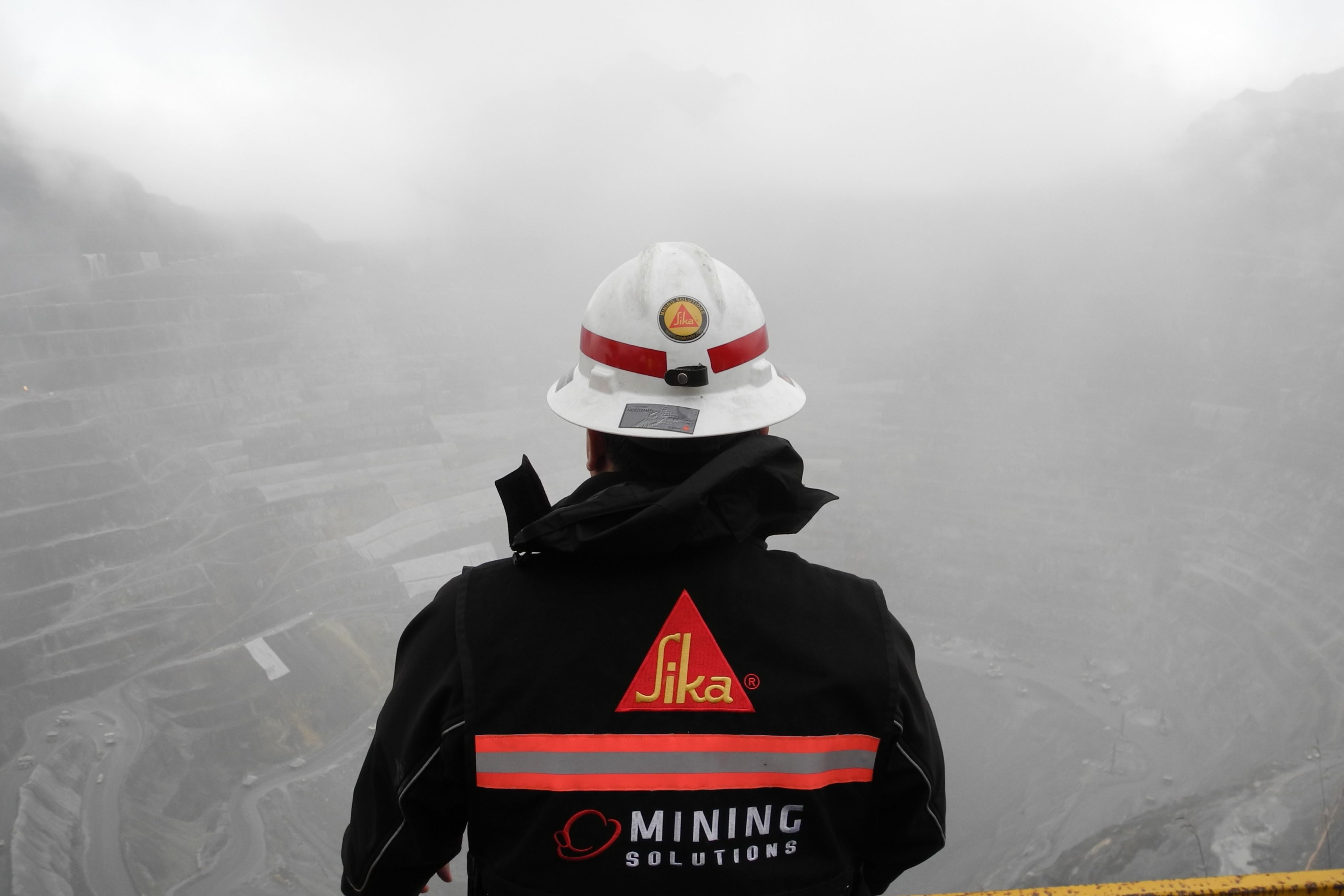 Sika worker looking at the Grasberg Copper-Gold Mine