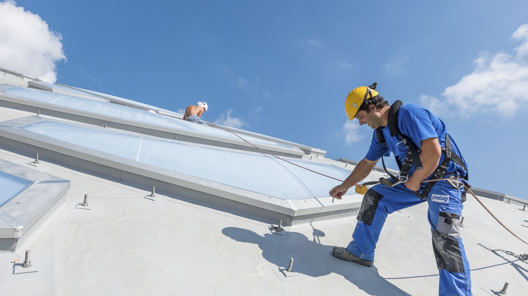 Worker on the roof of the Elephant House in Zurich Zoo