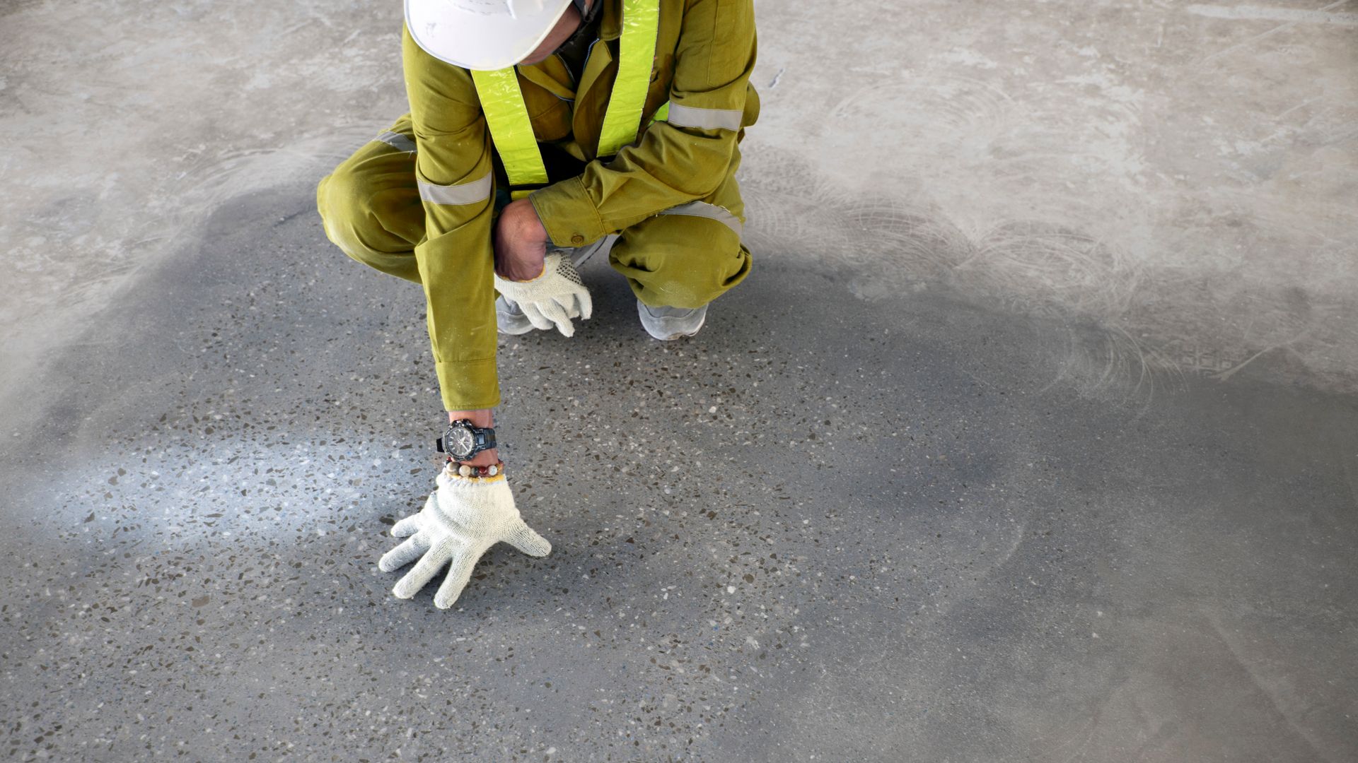 a construction worker check quality epoxy floor in warehouse factory japan construction site