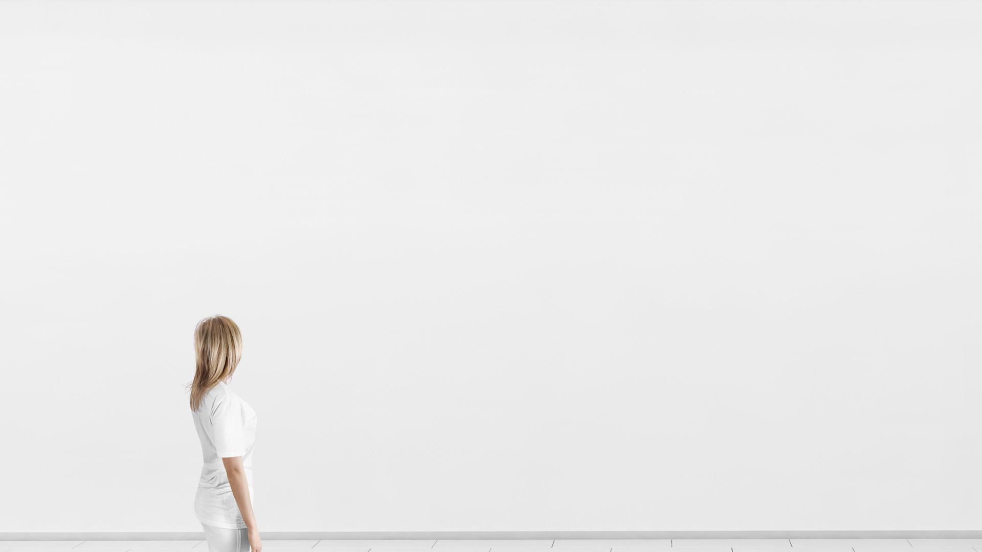 Empty big hall wall mockup. Woman walk in museum gallery with blank wall. White clear stand mock up lobby. Display artwork presentation. Art design empty floor. Expo studio wall in loft corridor.