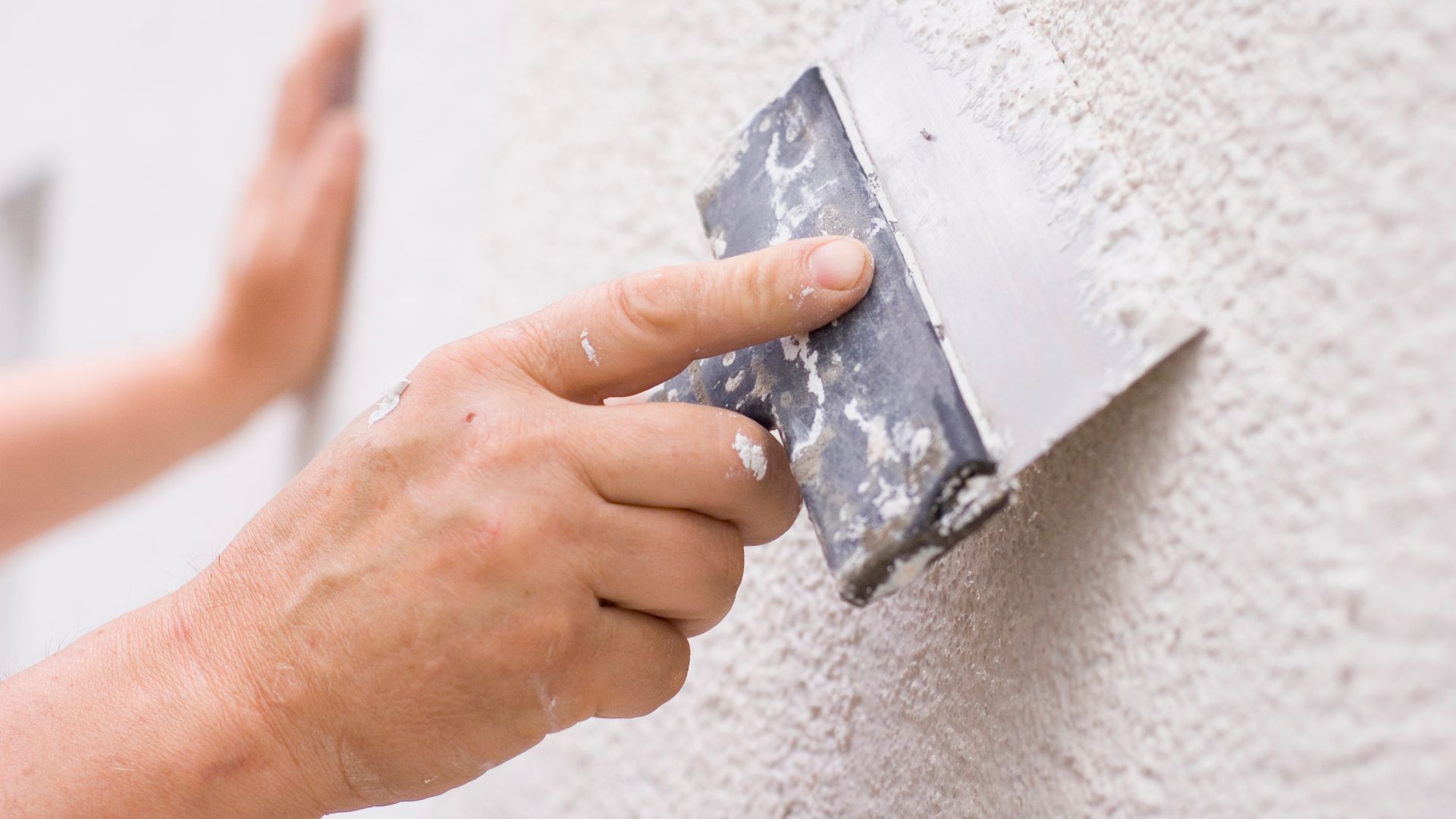 man holding a trowel

