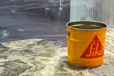 Yellow bucket with Sikafloor and metallic effect floor