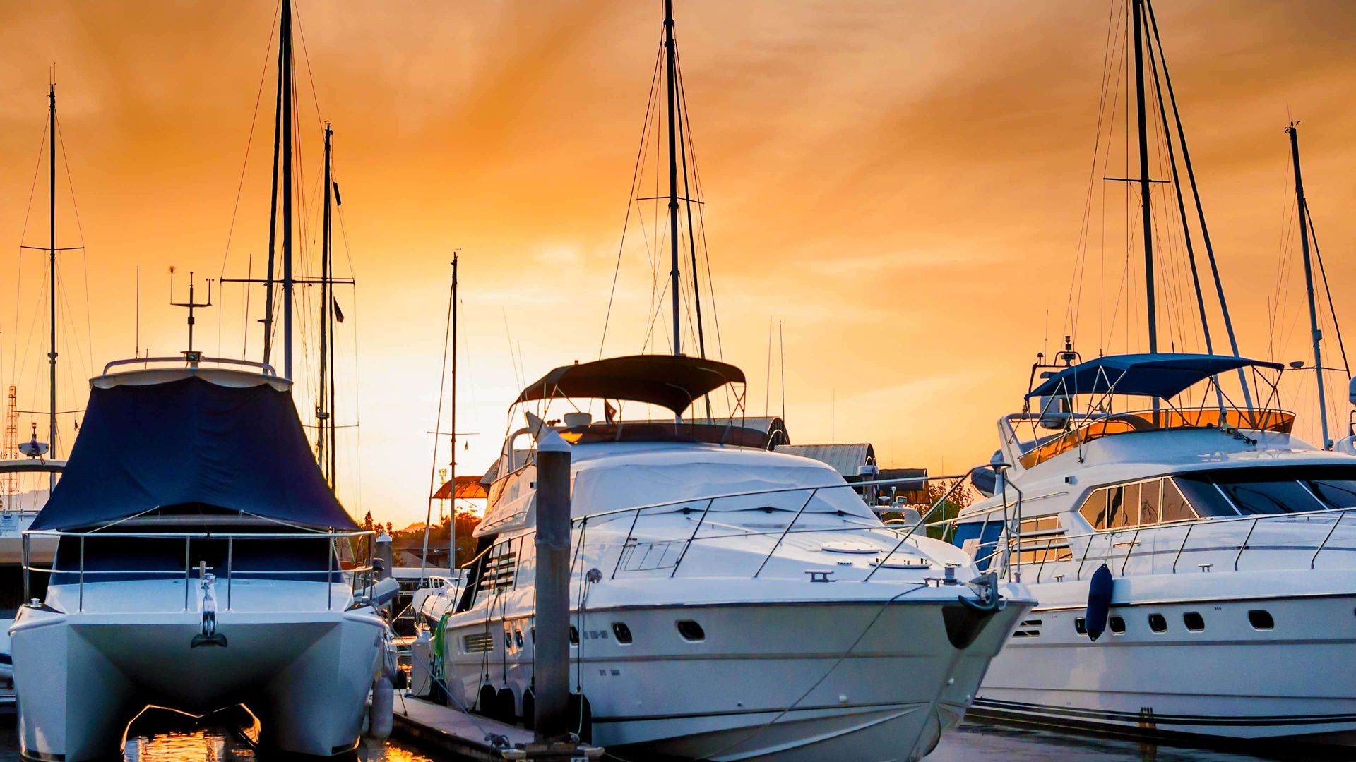 Yacht and boats docking at the marina in the evening, Phuket, Thailand