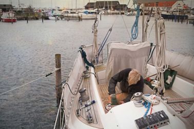 DIY Boat owner working on his boat, with Sika Marine repair products