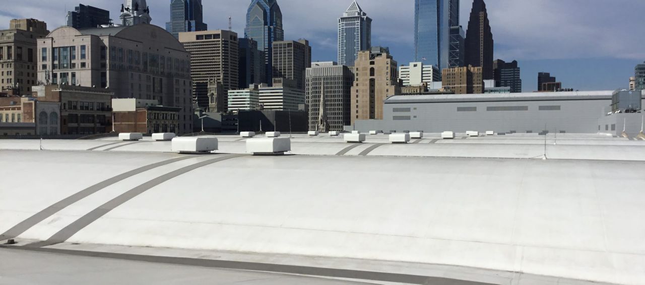 Skyline view from the top of the Pennsylvania convention center roof with a white membrane