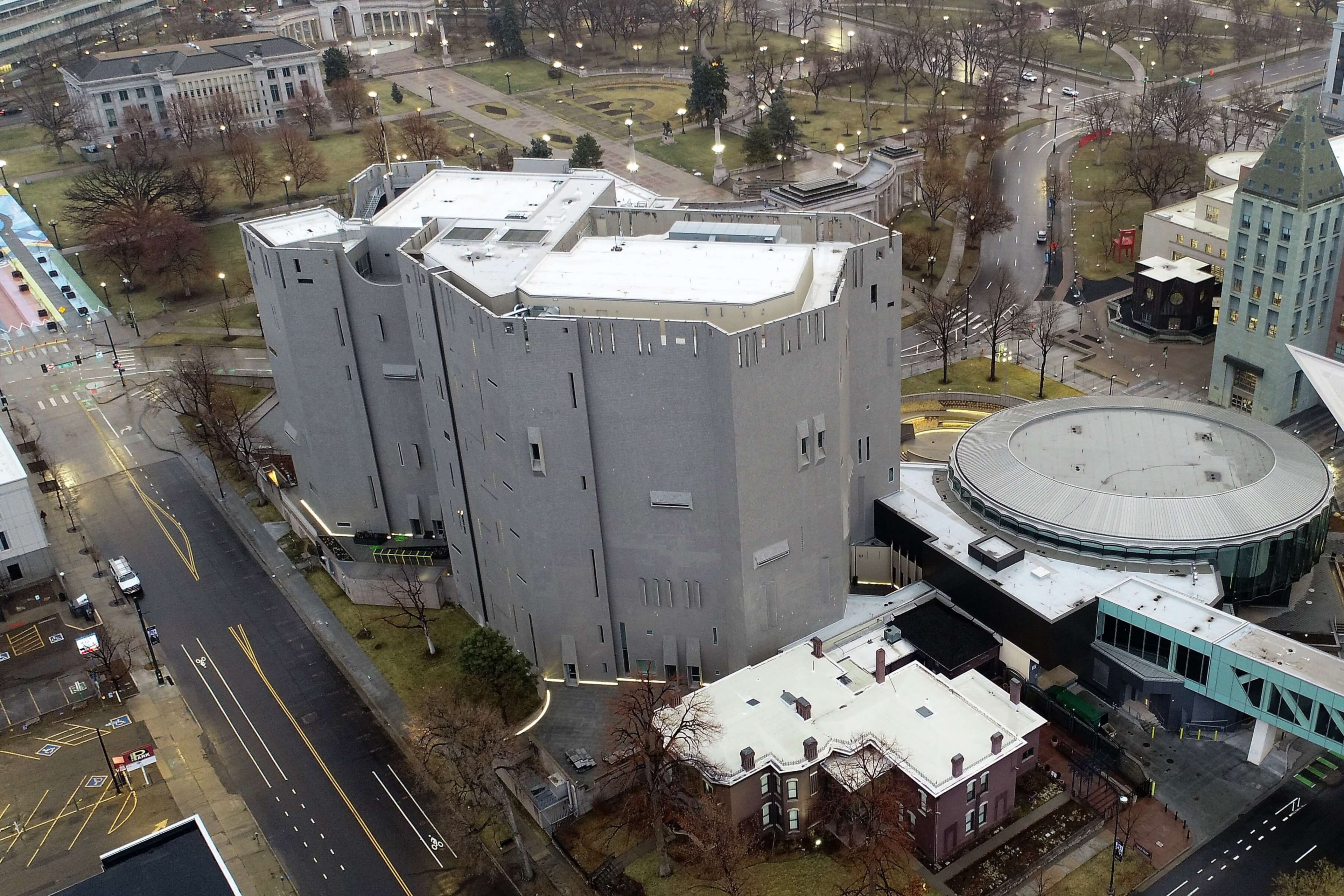 Aerial view of the Denver Art Museum showing a white Sarnafil roof overlooking the city