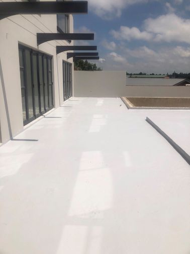 Acrylic waterproofing of residential flat roof in Secunda.