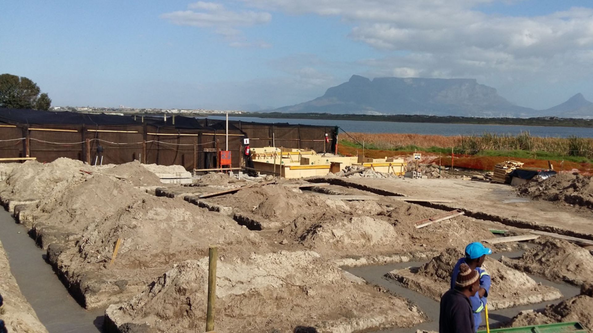 Men at working during the newly constructed exercise pools for SANCCOB. 