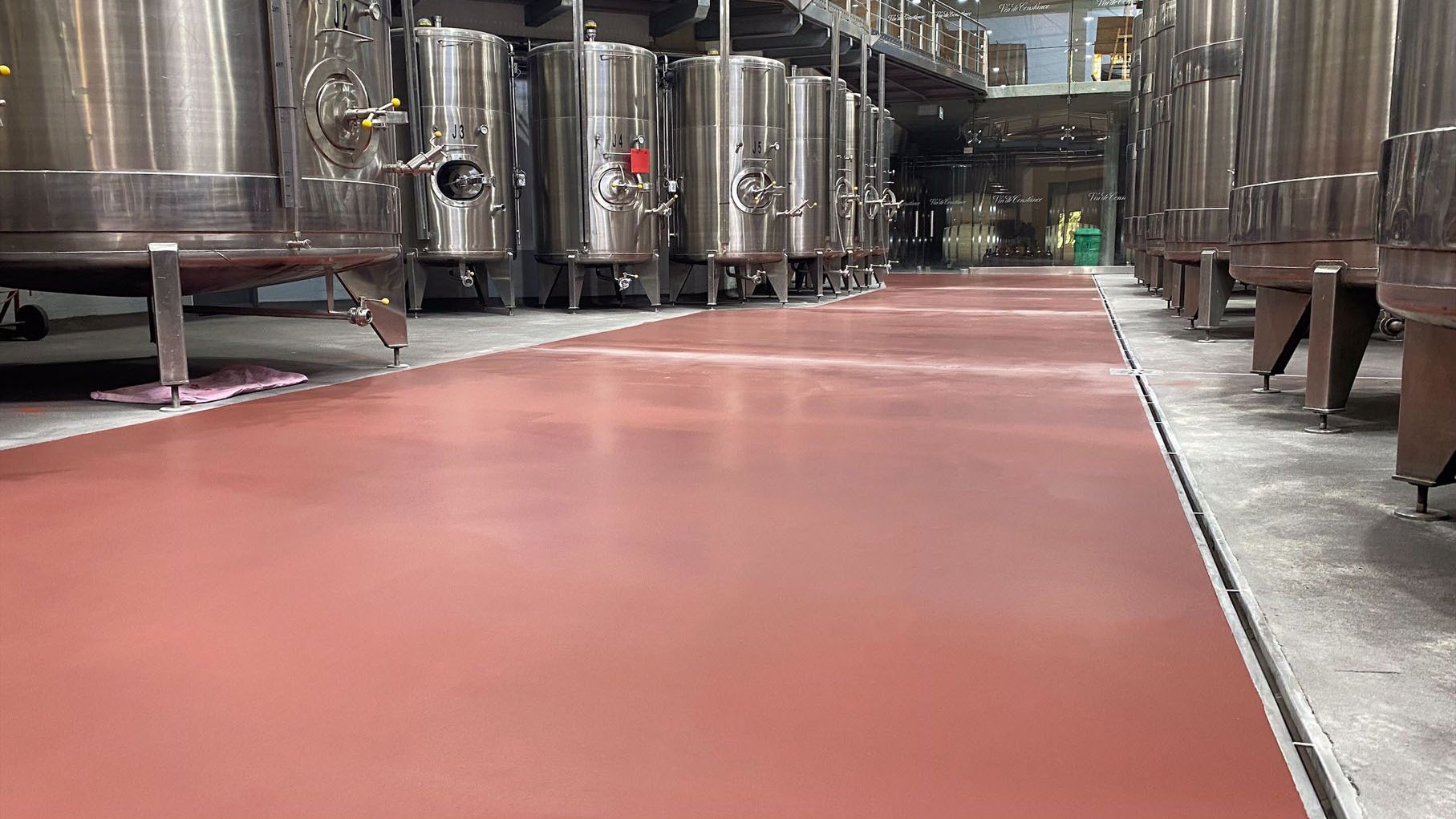 Polyurethane hybrid flooring at Klein Constantia wine estate in Cape Town. Slip resistant flooring that allows for steam cleaning and can withstand high impact.