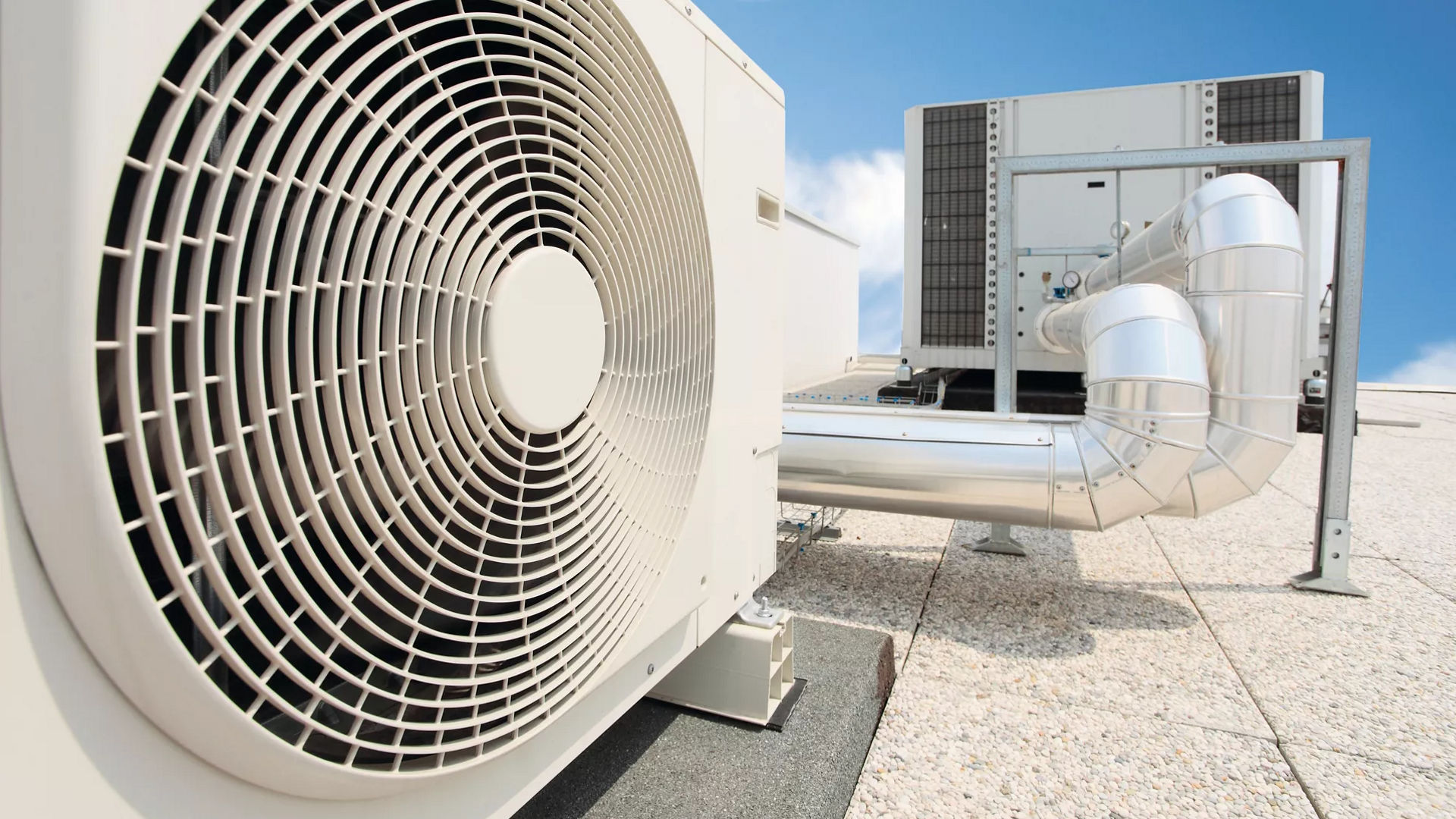 Outdoor HVAC unit with ventilation pipes