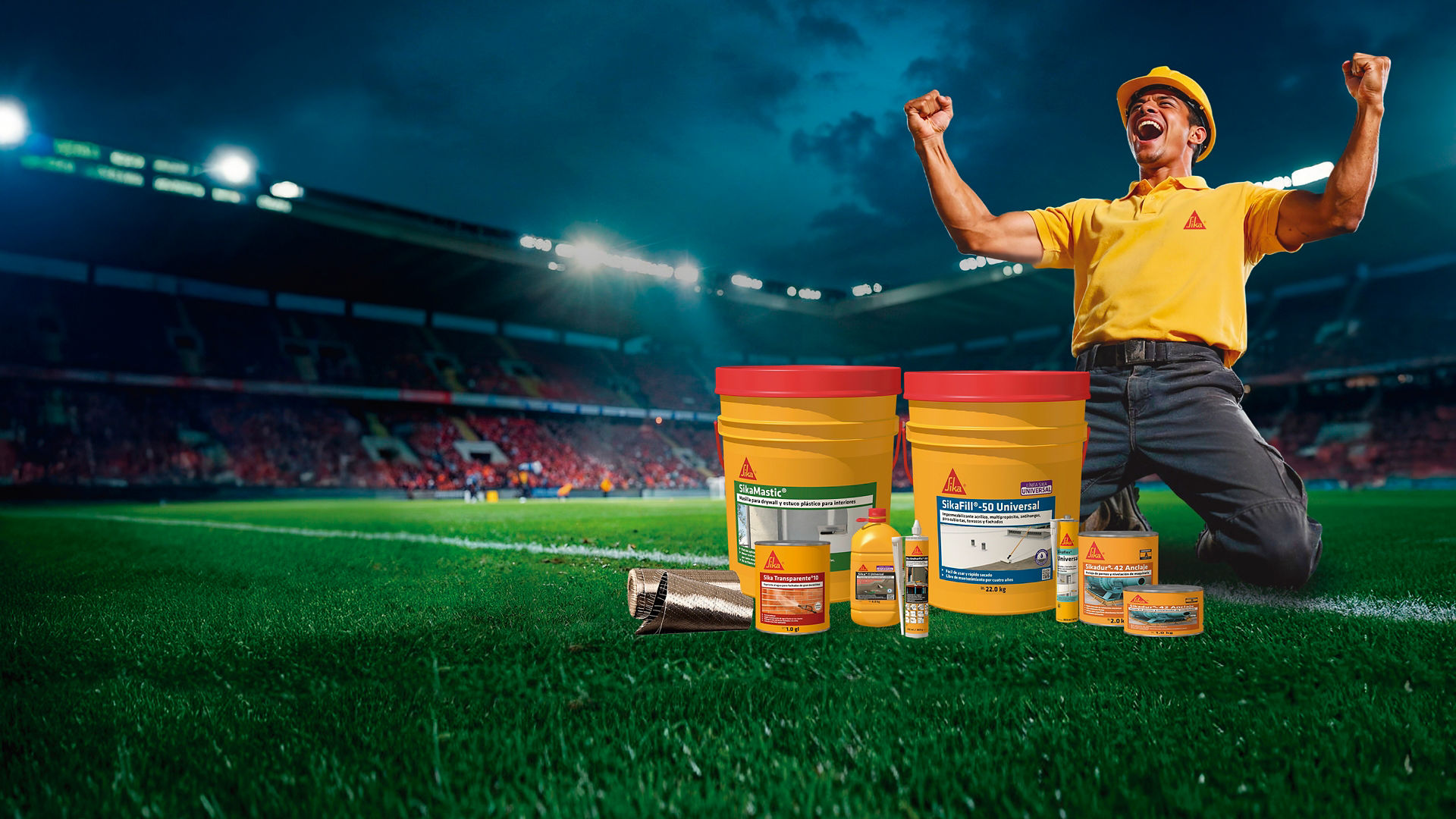 Construction worker celebrates with product containers on field