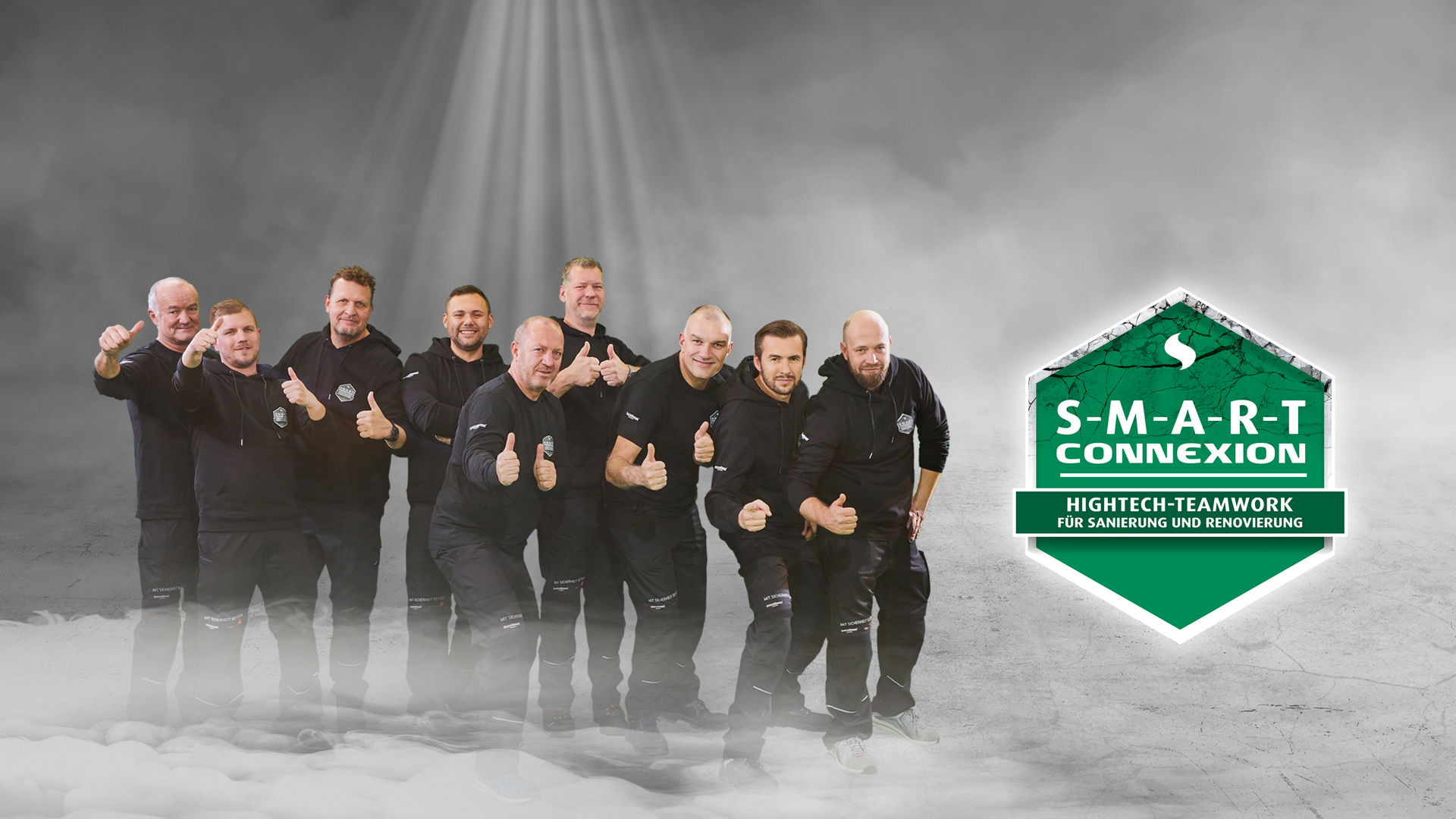 Team of men posing with S-M-A-R-T Connexion badge