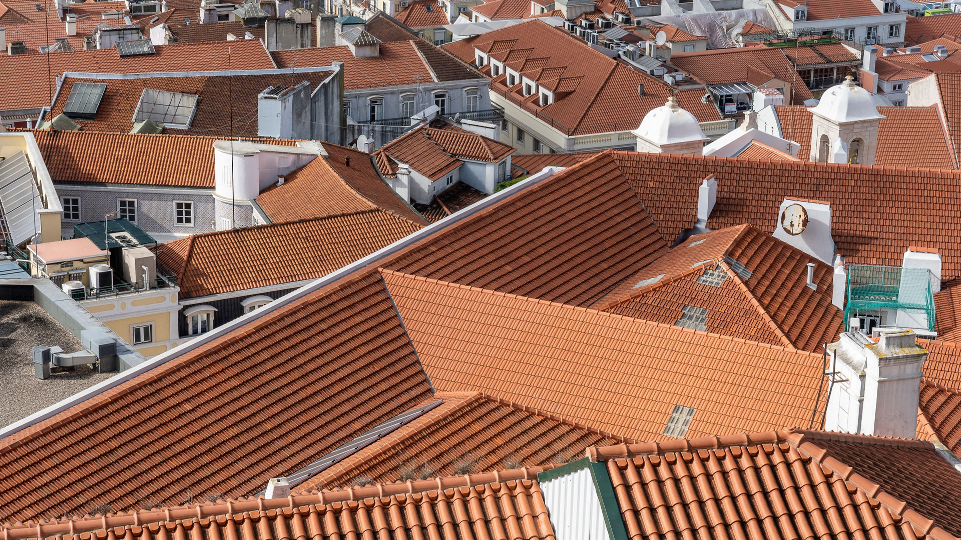 Red tiled rooftops in urban landscape