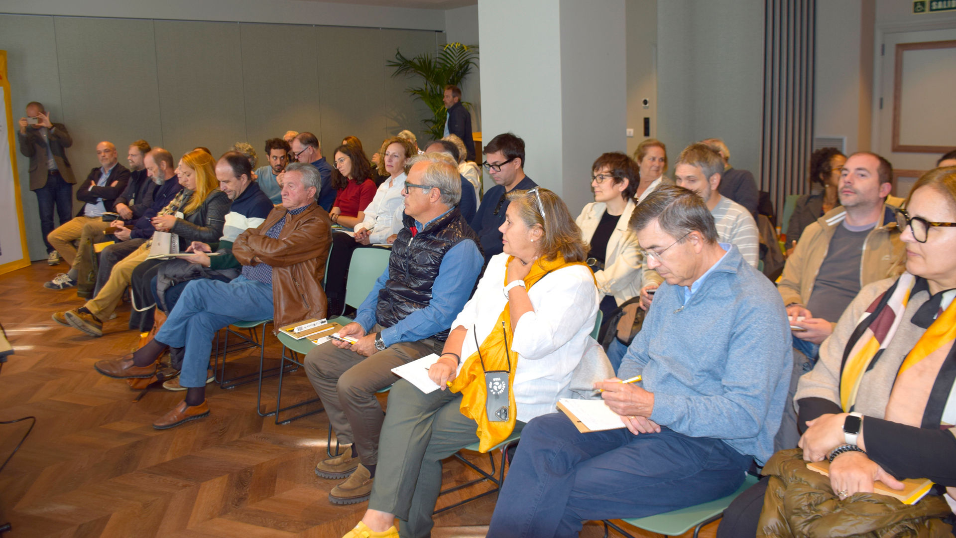 Audience attending indoor seminar session