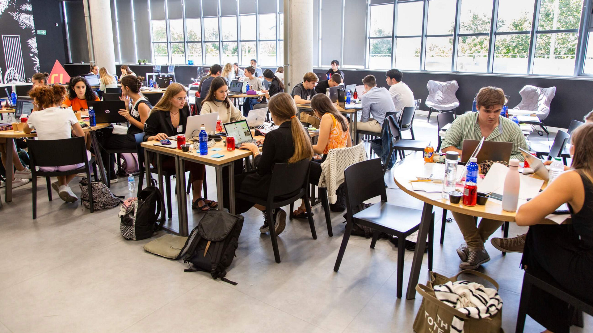 Group of students working in modern workspace