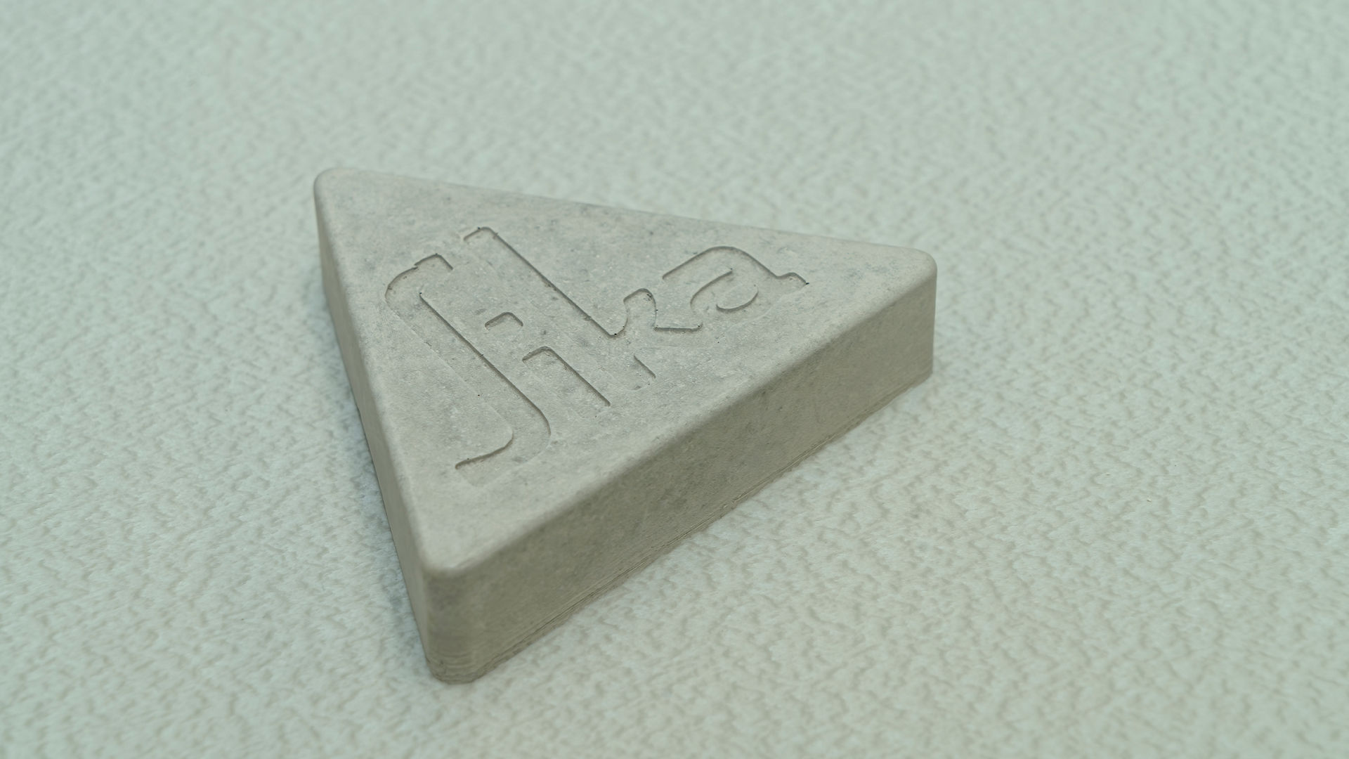 The Sika logo cast from concrete on top of a alayer of SikaPRoof waterproofing membrane (felt side up)