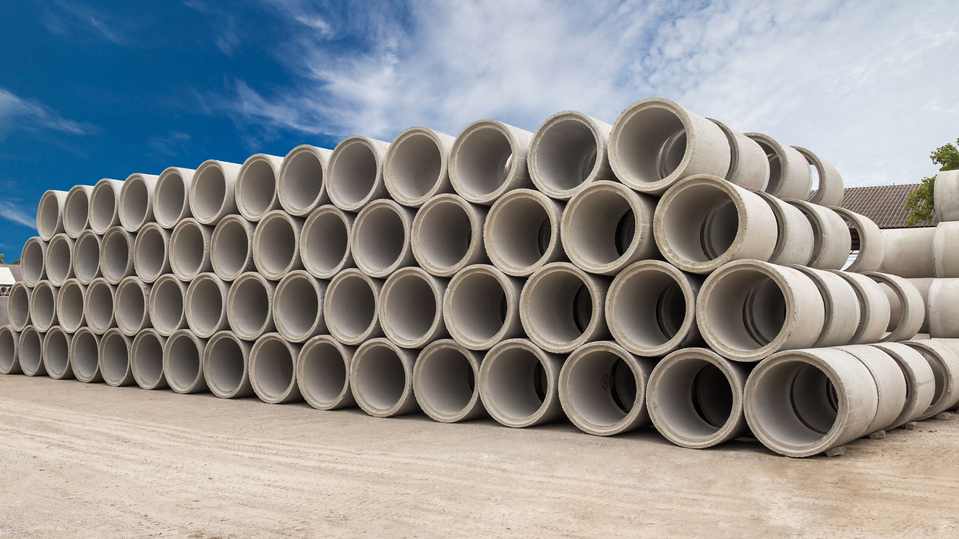 Precast concrete pipe segments stacekd on top of each other
