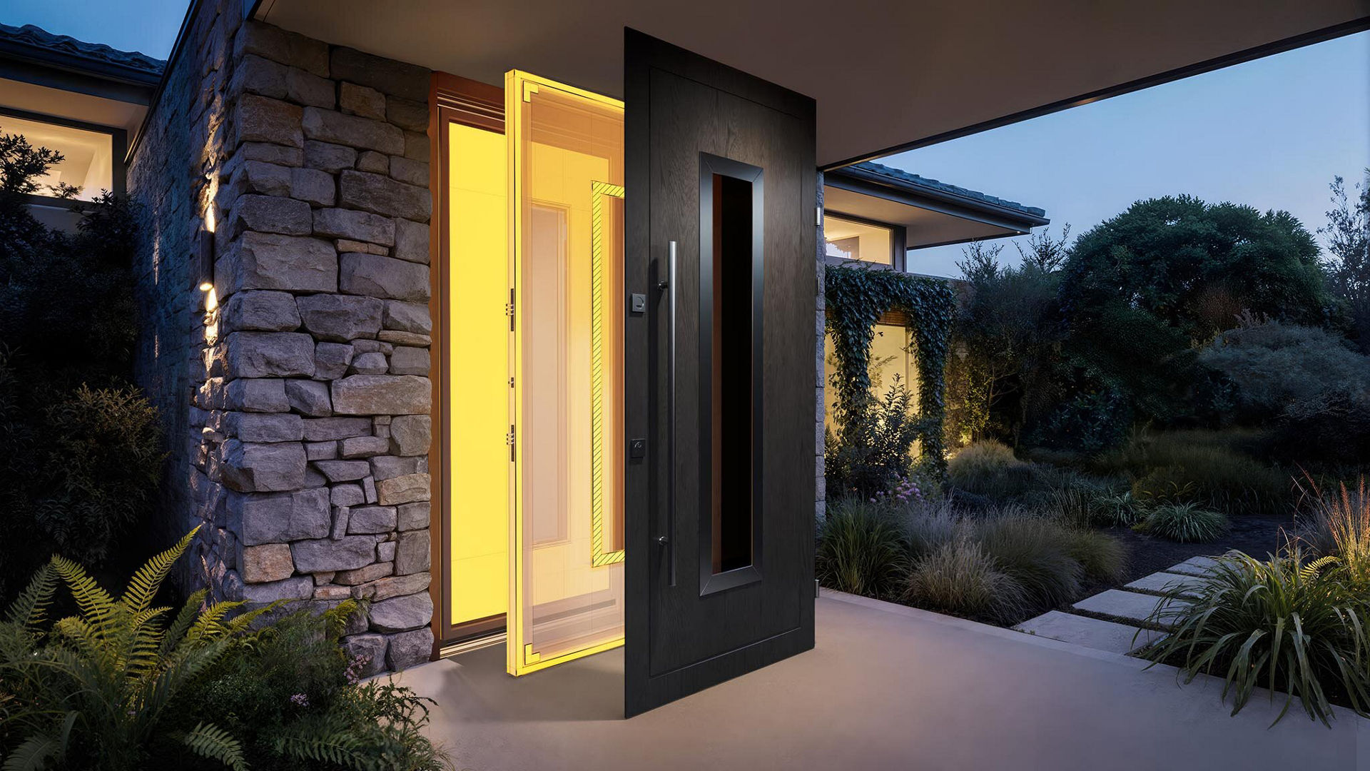 Modern front door with glowing yellow interior light