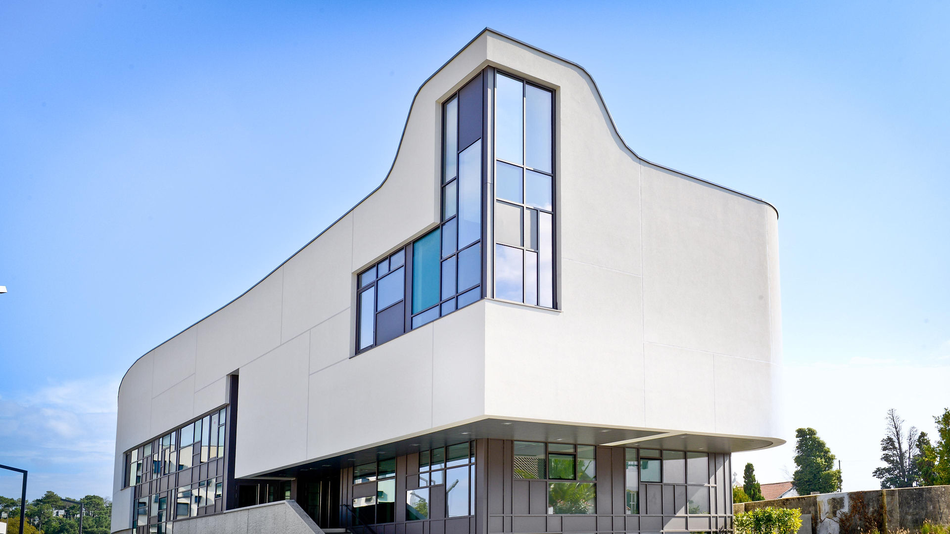 Modern white building with curved architectural design