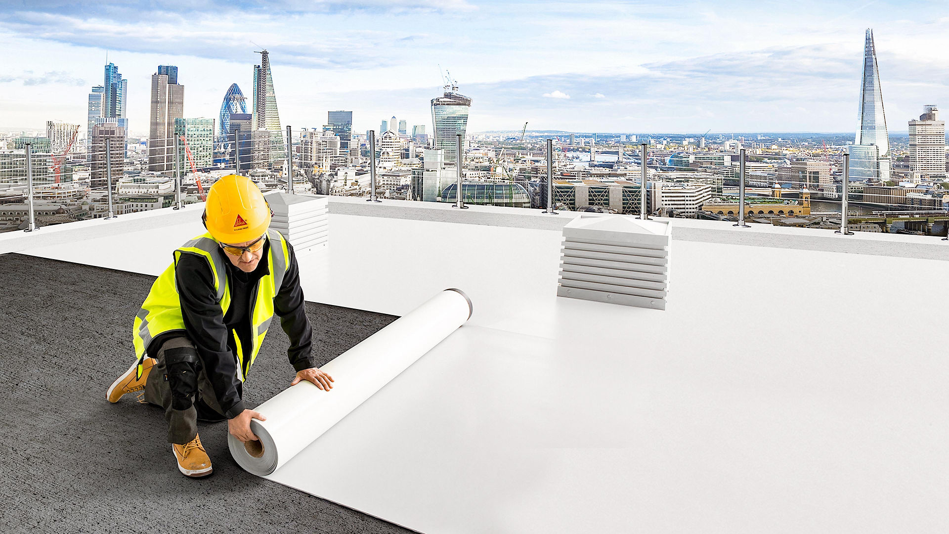 Worker Installing White Roofing Membrane on City Rooftop
