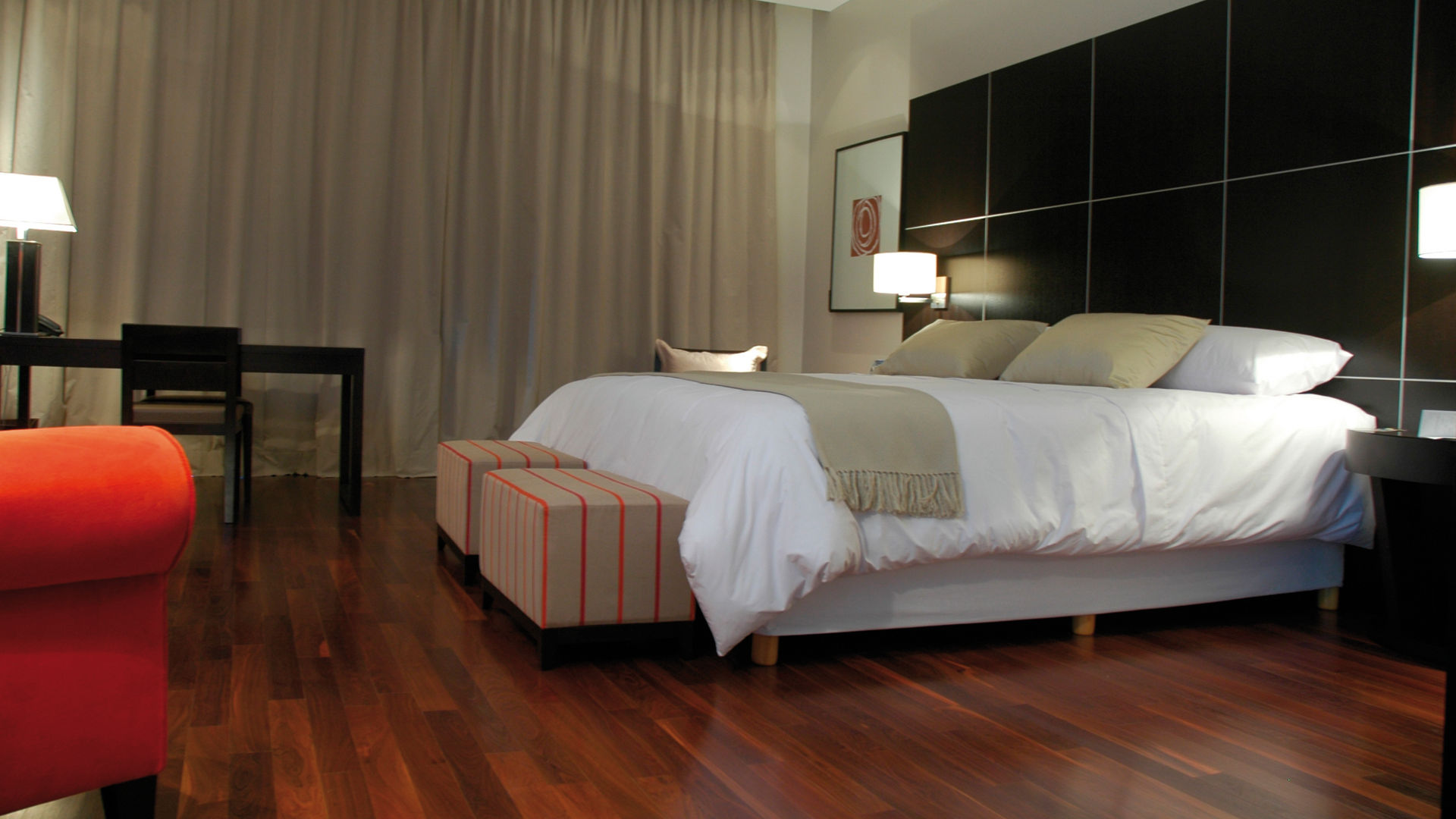 bedroom with wood floor hotel room with bed