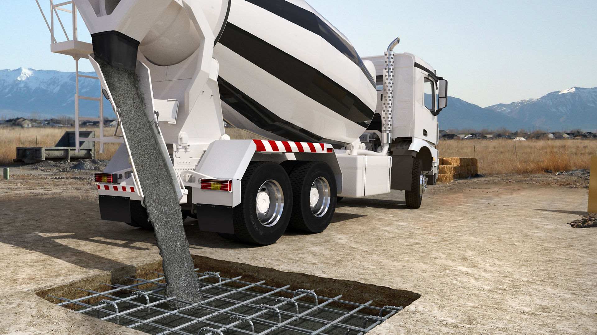 Concrete mixer vehicle empties concrete into a filling