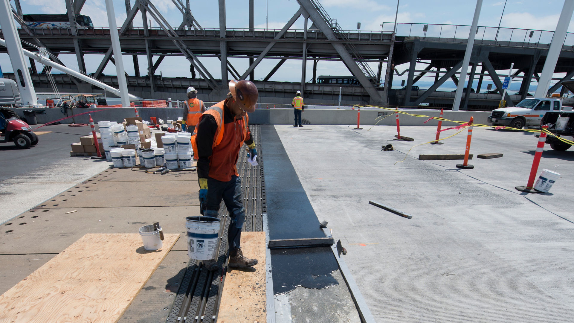 Worker applying material in Wabo expansion joint on Bay Bridge