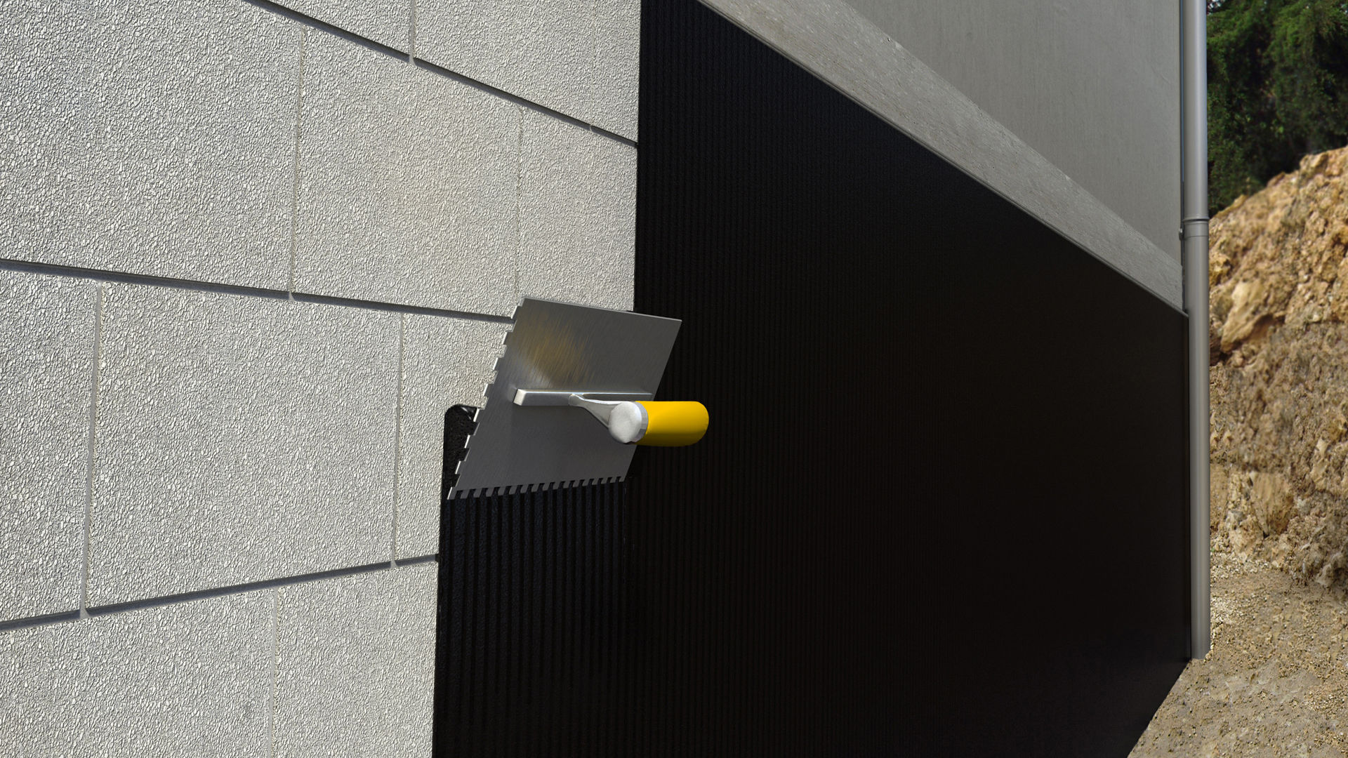 Protective coating is applied to the wall with a trowel