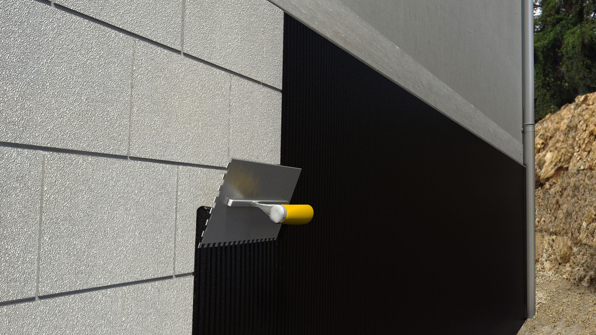 Protective coating is applied to the wall with a trowel