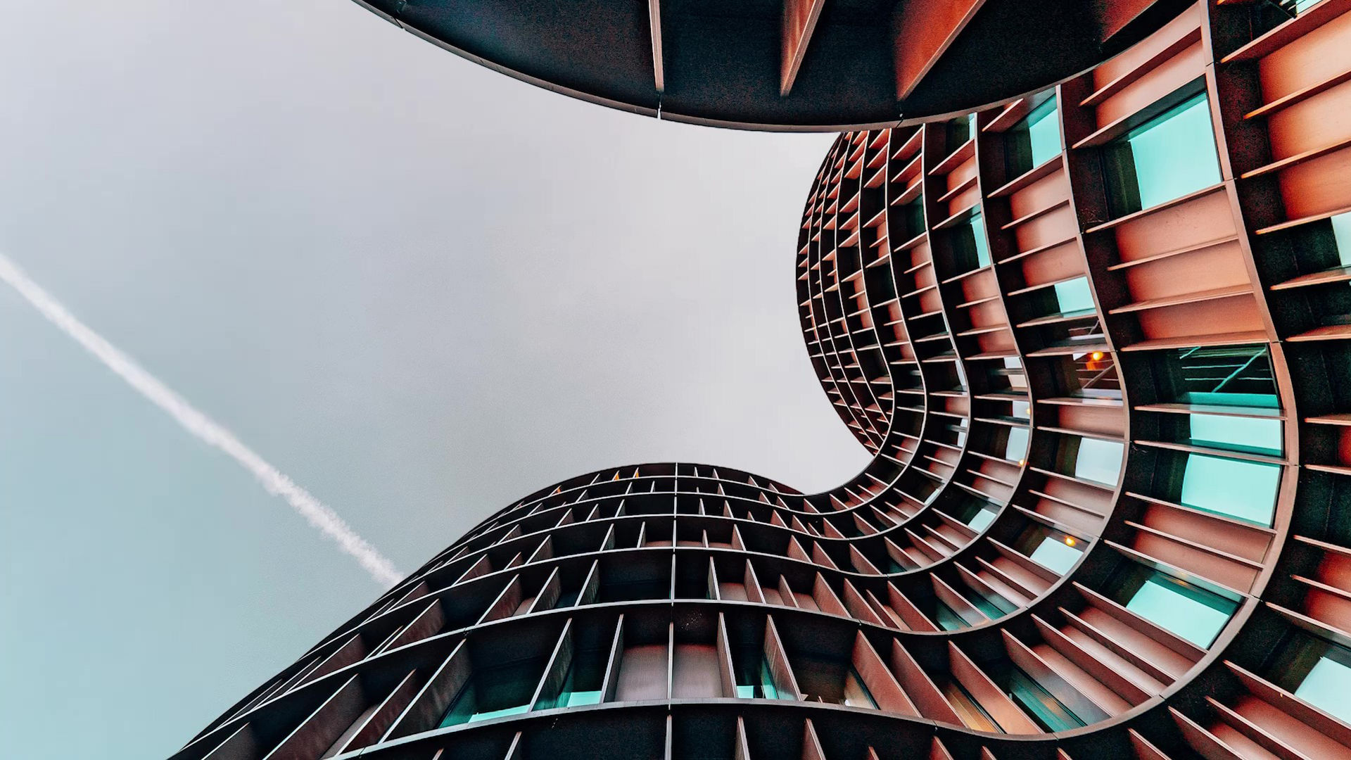 Curved Modern Building Against Clear Sky View