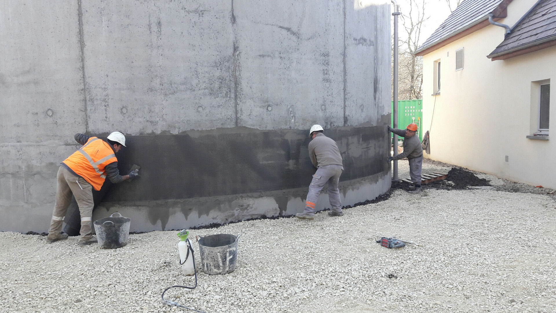 men refurbising souesmes wastewater treatment plant