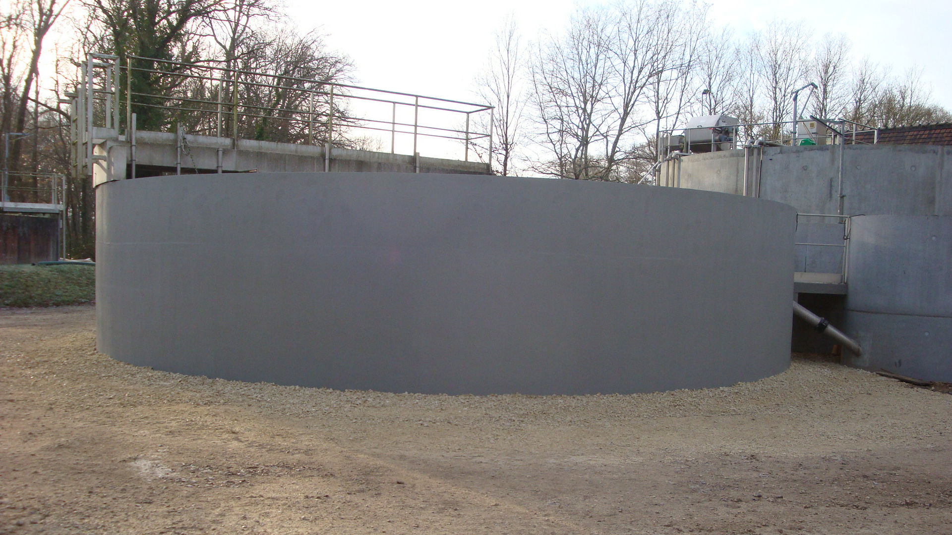 men refurbising souesmes wastewater treatment plant
