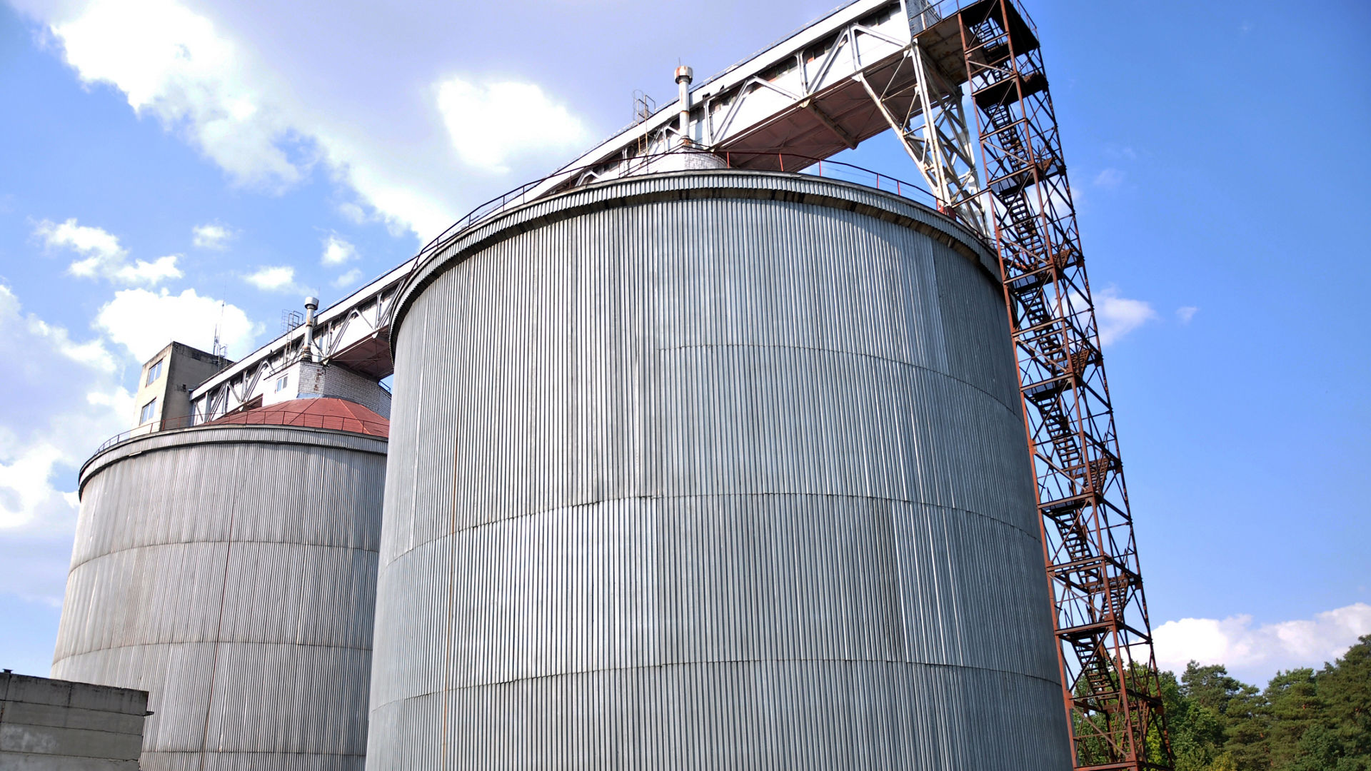 Two metal silos next to each other