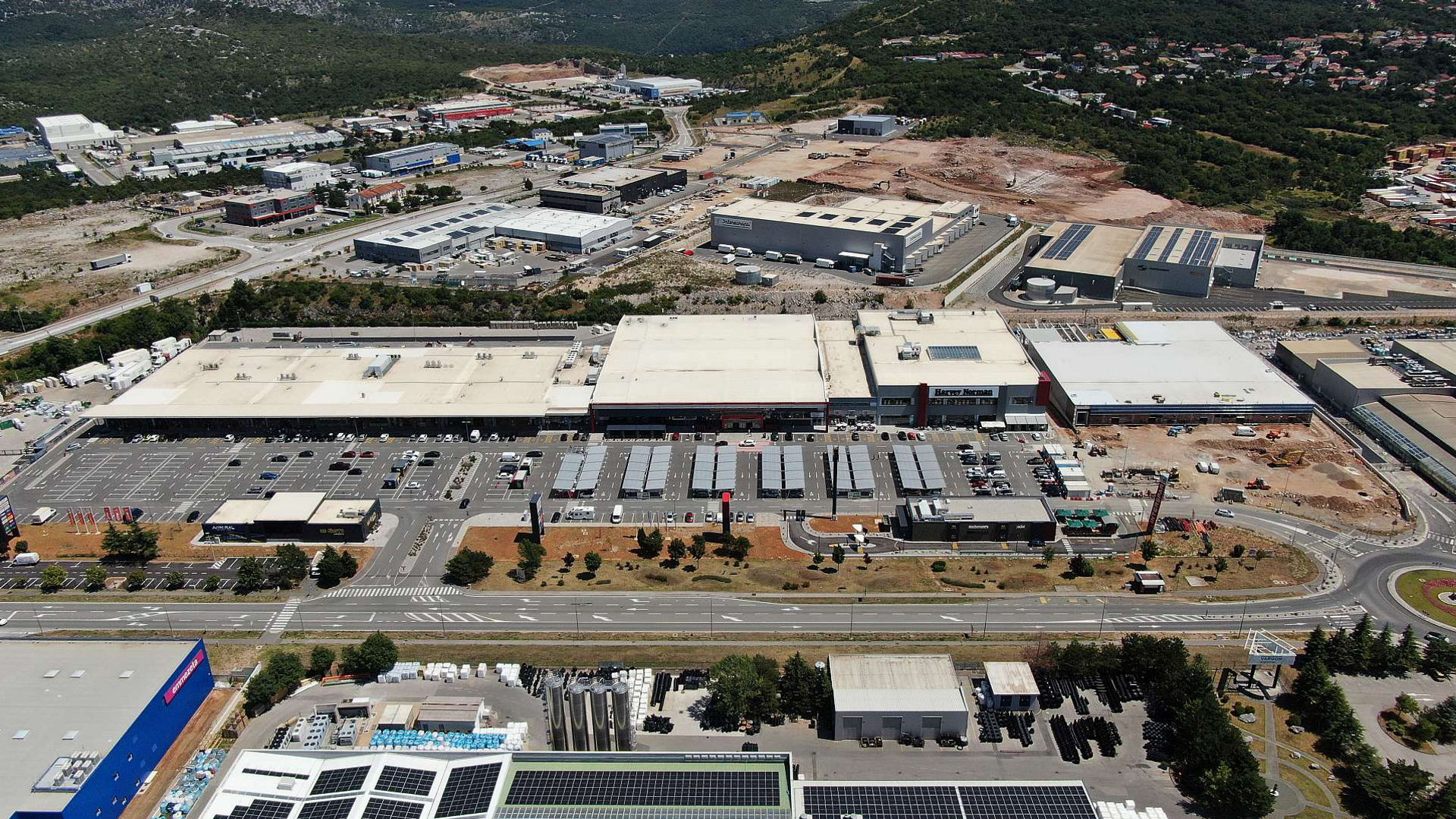 Aerial view of industrial complex with solar panels