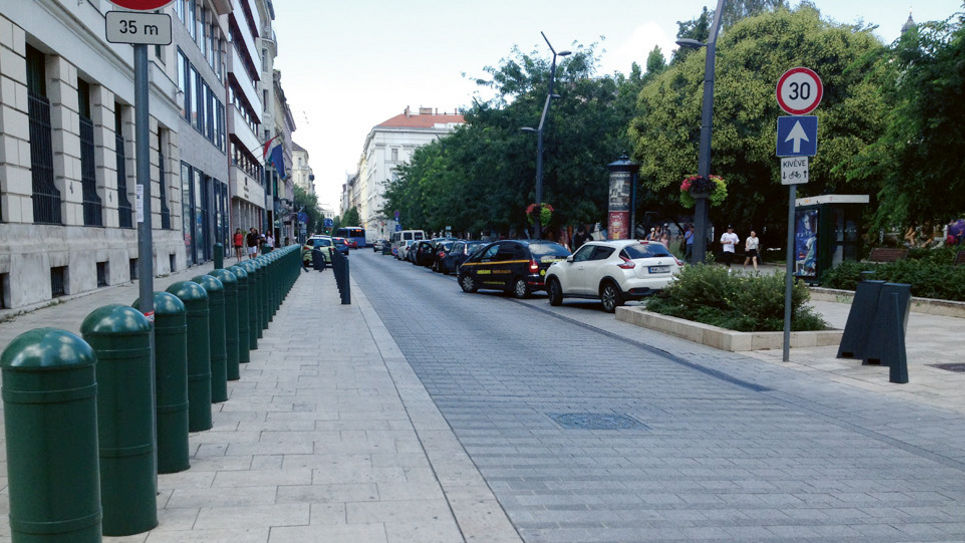 Urban street with traffic and signage