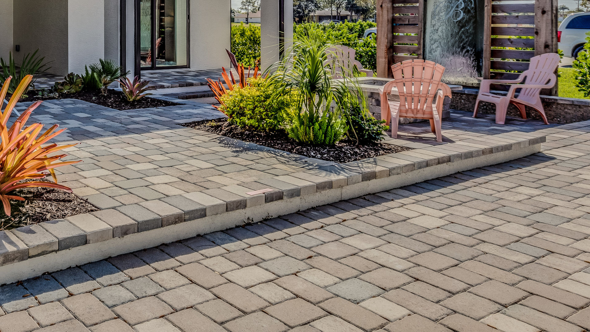 Modern patio with stone pavers and outdoor seating