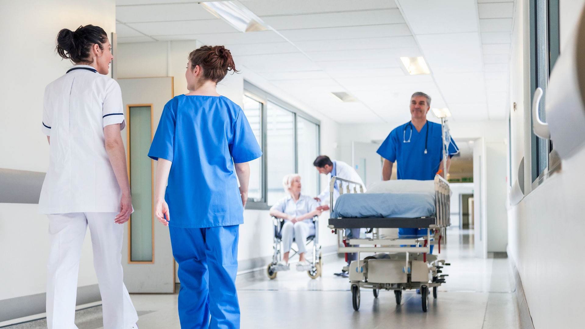 Healthcare professionals in hospital corridor