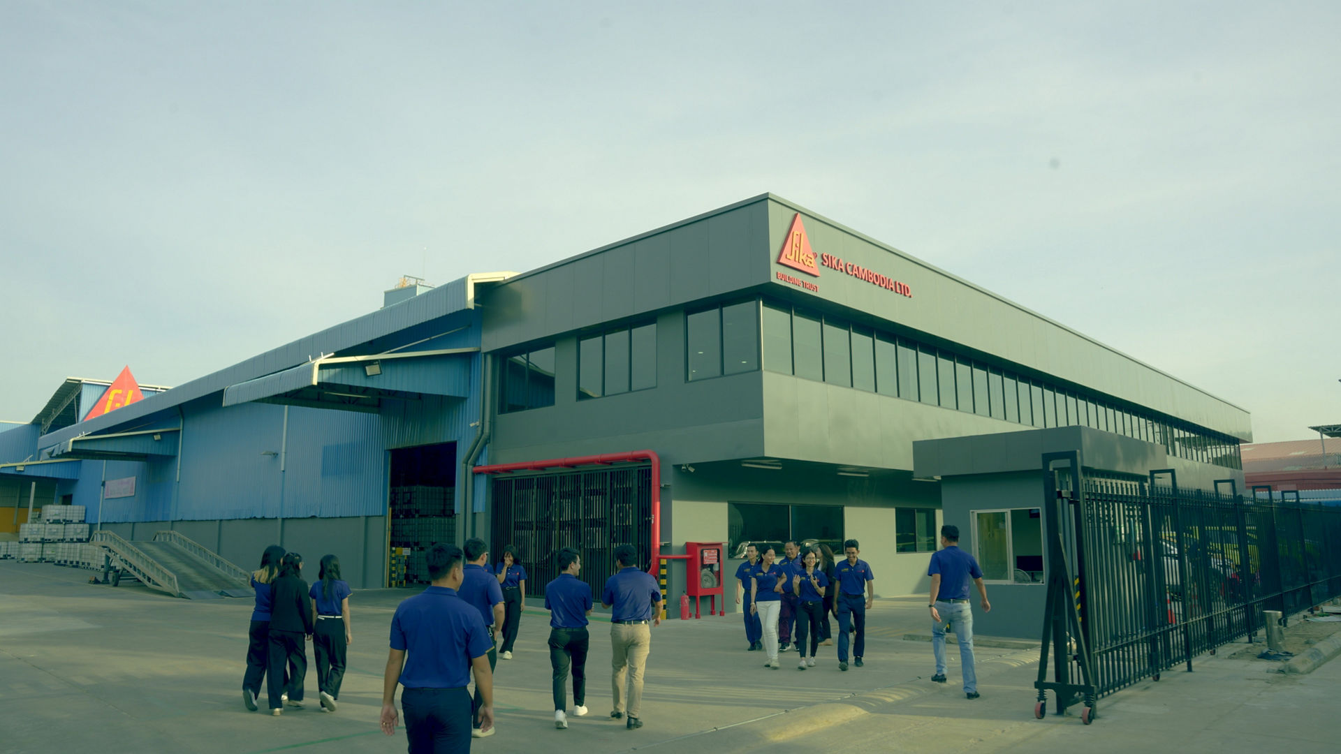 Industrial Facility with Workers Outside